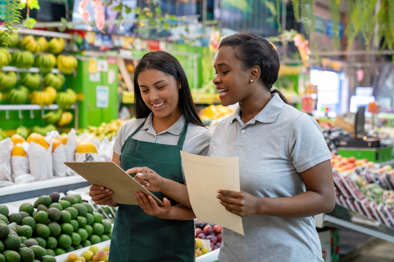 Small business owners reviewing paperwork together